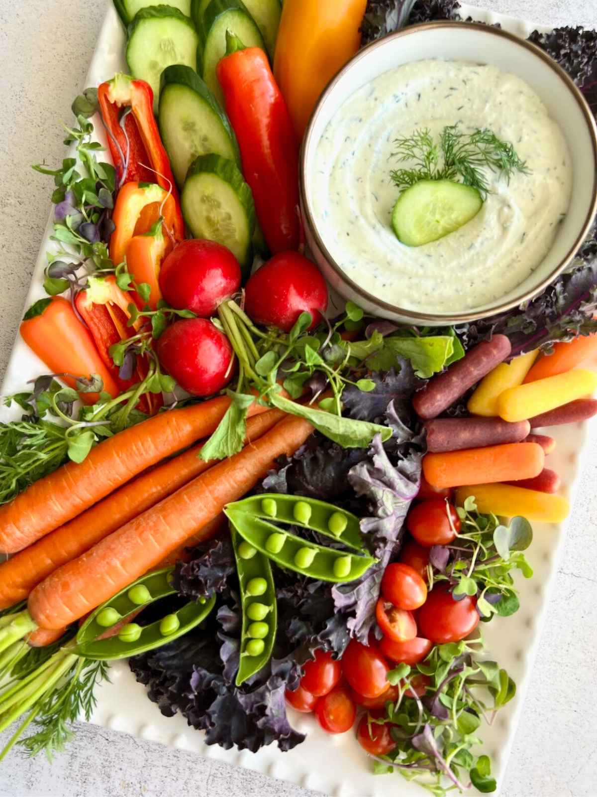 Cottage cheese ranch dip surrounded by vegetables.
