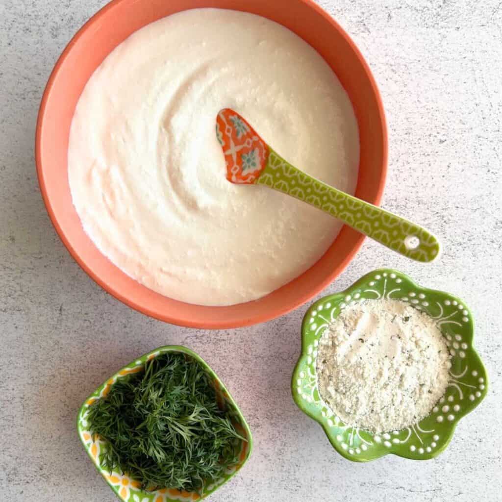 Cottage cheese ranch dip ingredients in separate bowls.