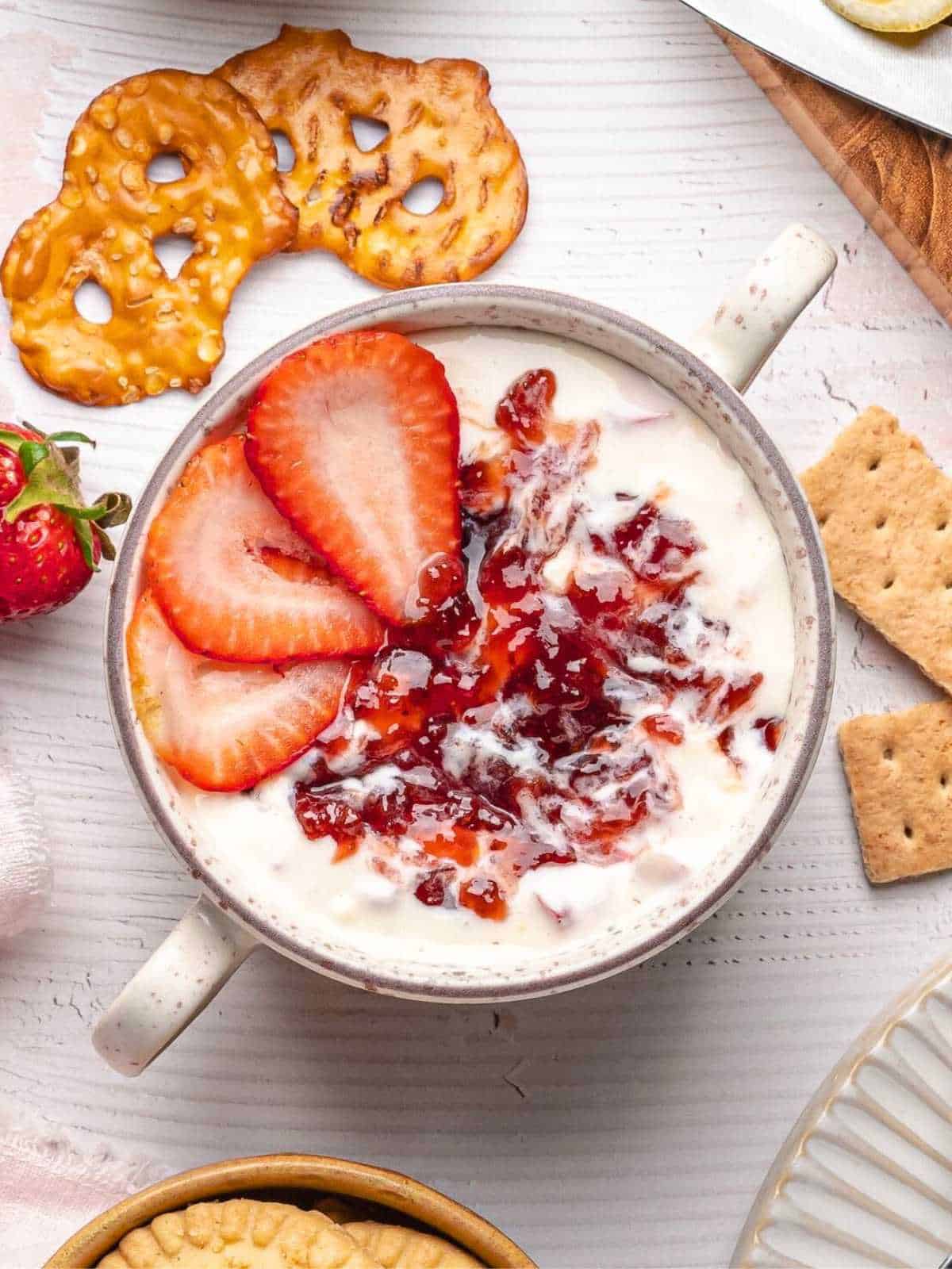 Strawberry preserves and strawberries on top.