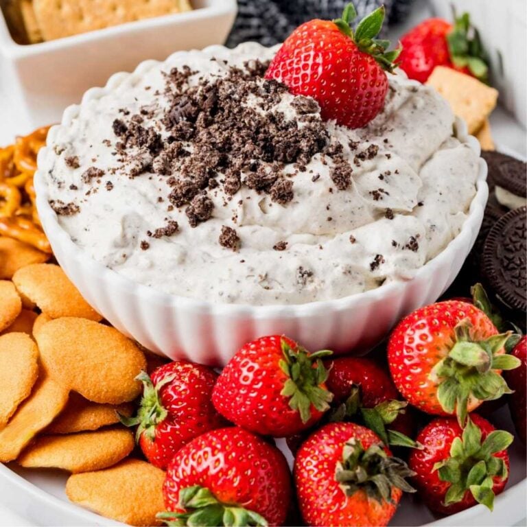 Oreo Dip surrounded by strawberries and vanilla wafers.