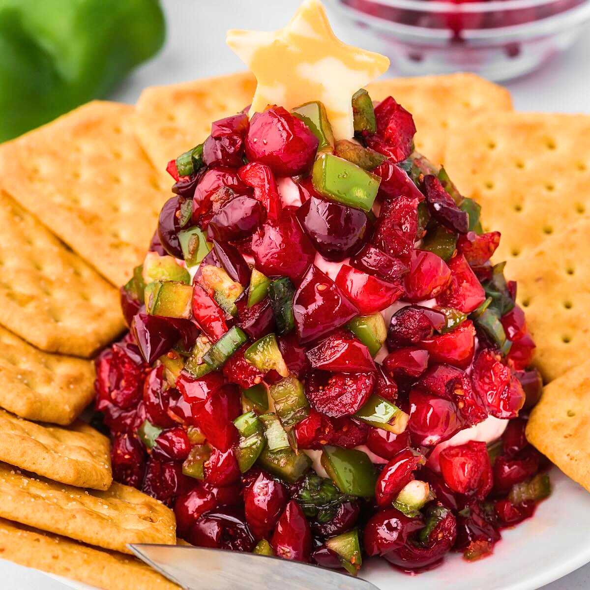 Cranberry Jalapeño Dip shaped like a Christmas Tree with a star on top.