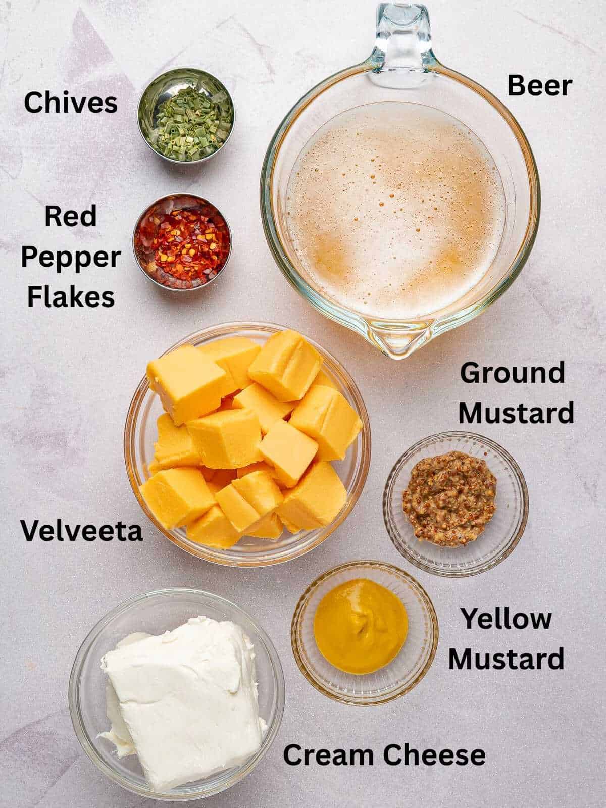 Ingredients needed to make beer cheese pretzel dip.
