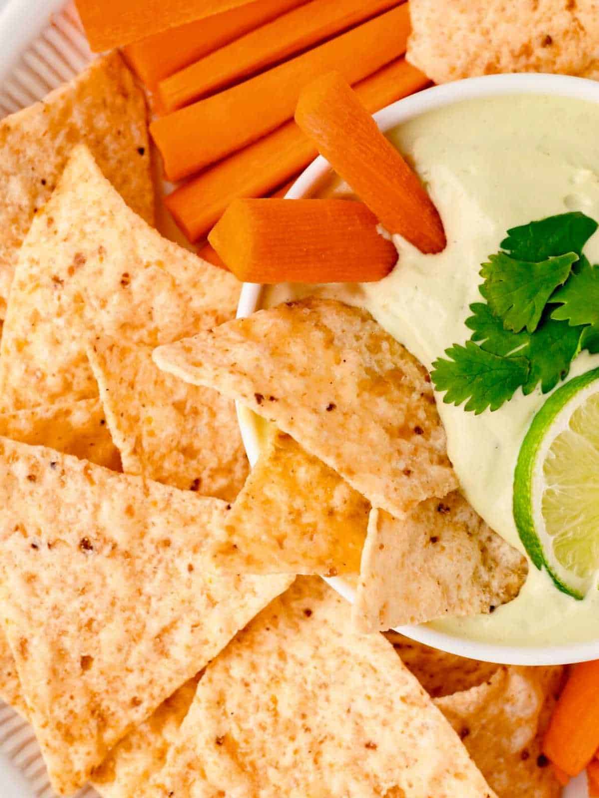 Carrots dipping into Avocado Ranch Dip.