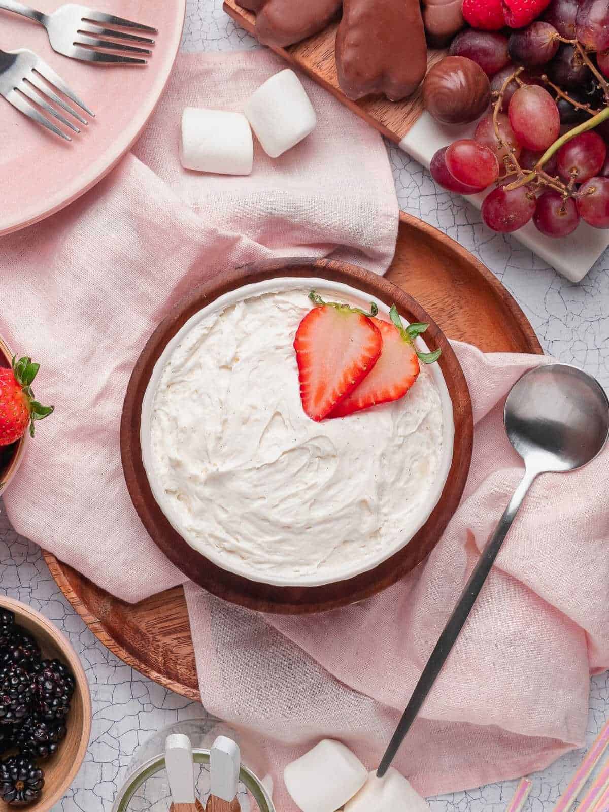 Marshmallow dip in a wooden bowl.