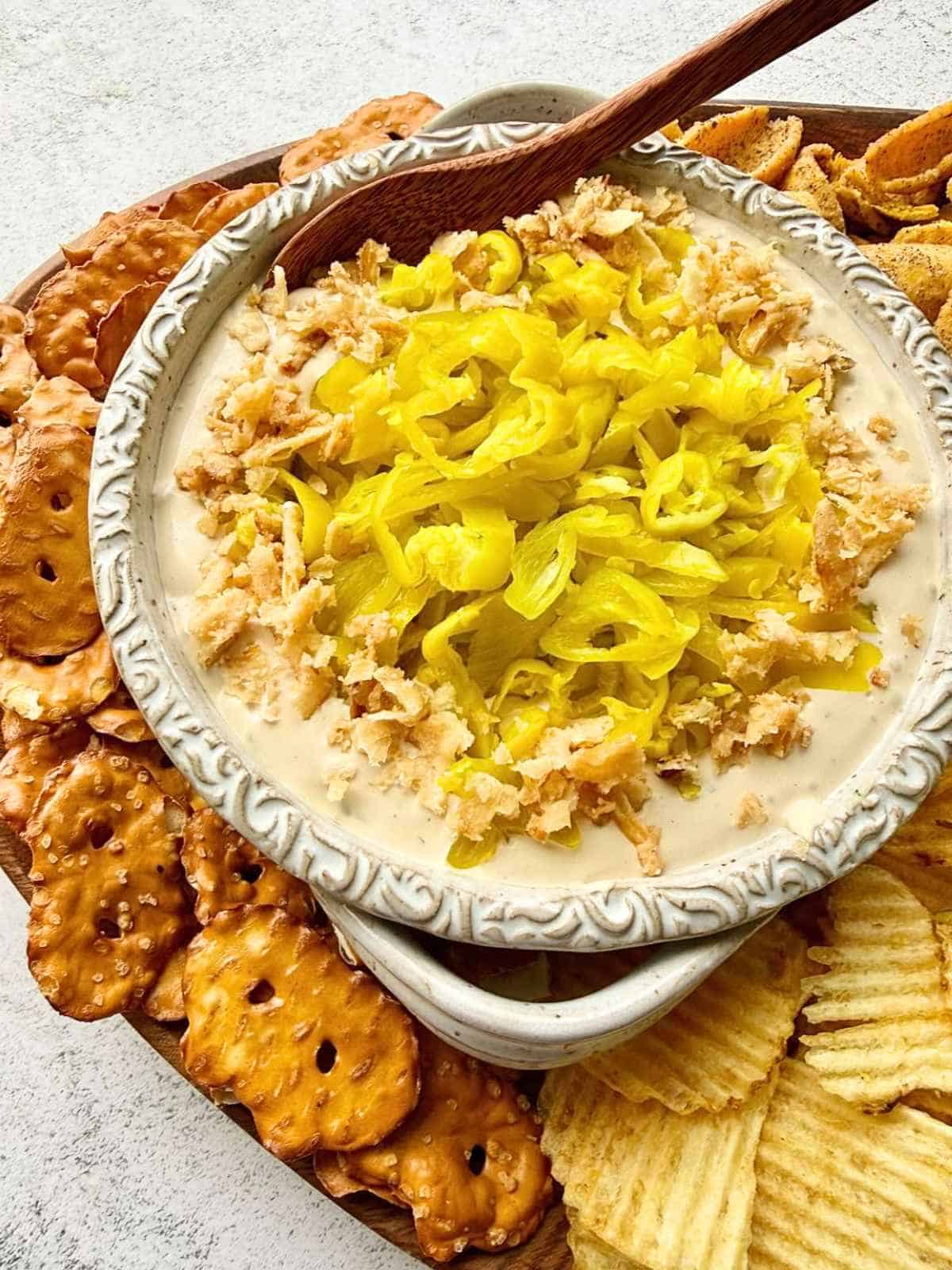 Mississippi pot roast dip with a wooden spoon dipped into it.