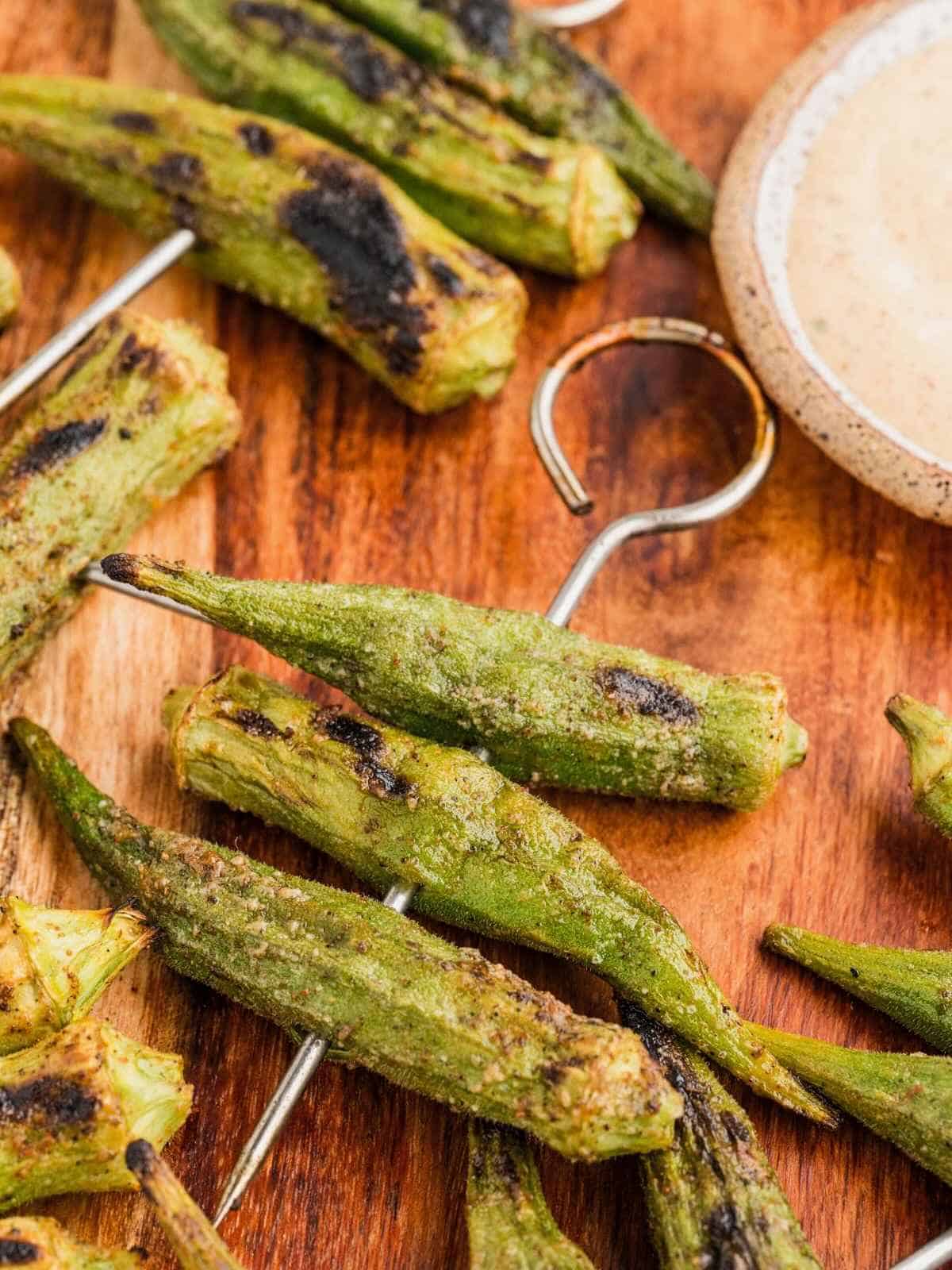 A skewer of grilled 3 grilled okra.