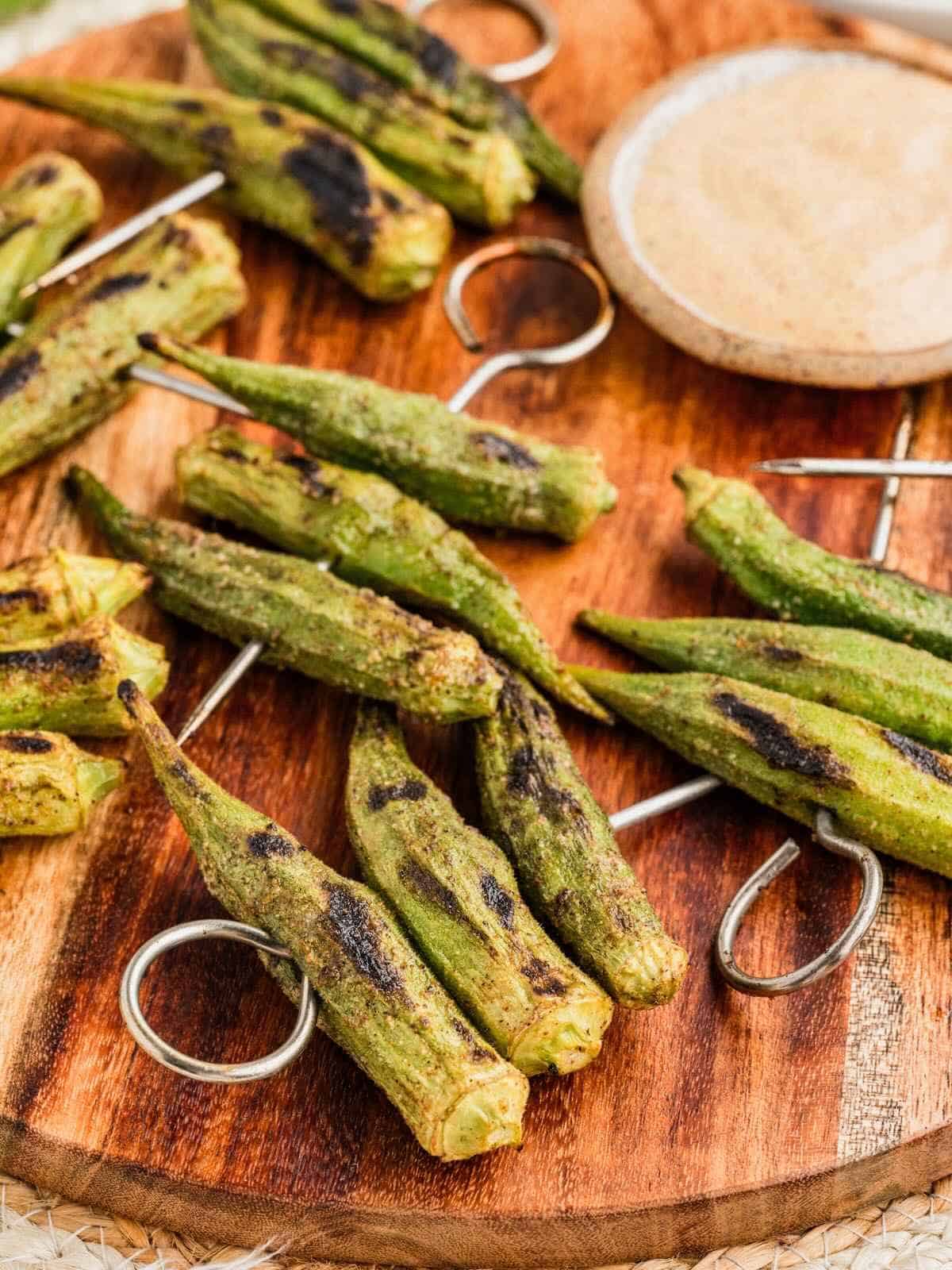 Grilled okra on skewers with Cajun spices.